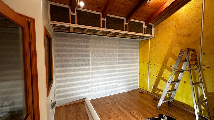 The wall covered, ready for fabric