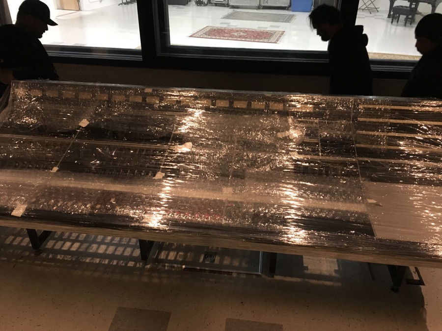 The console arrives, still wrapped